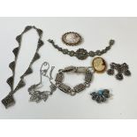 A collection of costume jewellery including cameo brooches, amethyst and turquoise white metal