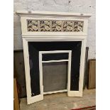 A late 19th early 20thc fire surround, the white painted iron with five floral tiles to frieze