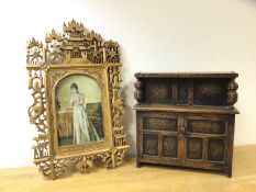 A novelty miniature court cupboard, the top tier hinged with music box to interior, over recess to