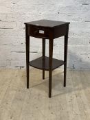 A early 20th century mahogany side table, the bow front over drawer raised on square tapered