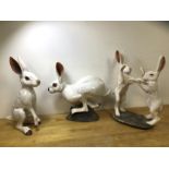 A collection of ceramic hares, one with initials BA to base (?), (tallest 36cm h)