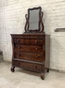 An early 19th century mahogany chest, the mirror back swivelling between scrolled uprights, over