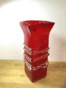 A Whitefriars style vase, red vase with flared rim of square form, with clear glass naturalistic