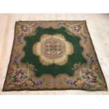An Edwardian chenille table cloth with central floral medallion with floral spandrels, (150cm x
