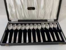 A boxed set of 12 silver coffee spoons, Sheffield 1962, in box bearing label Alexander Scott,