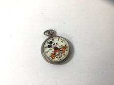 A vintage Ingersoll Mickey Mouse pocket watch lacking hour hand and glass, a/f (5cm diameter)