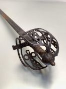 A Scottish basket hilted broad sword, the panel and bar construction with pierced heart