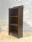 A mahogany open bookcase, early 20th century, with raised back over moulded top and three shelves,