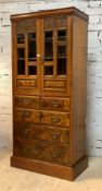 An Edwardian combination cupboard (Converted from a combination wardrobe) the cushion cornice over