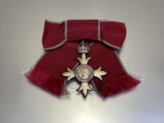 Member of the British Empire breast badge, 2nd type. On lady's bow