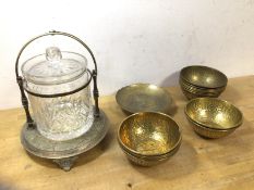 A set of twelve Indian beaten brass bowls, with naturalistic decoration and animals to well, (4.