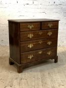 A Handsome George III oak chest, late 18th century, the moulded top over two short and three long