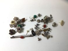 A collection of stud earrings including carnelian, amber, and silver, a carnelian bar brooch etc (