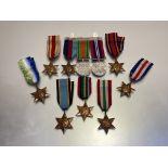 British stars and medals. 1939-45 Star, Defence medal and War medal, swing mounted. Atlantic Star.