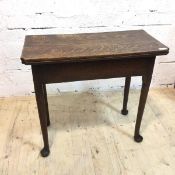 A George III gate leg tea table the fold over top with moulded corners on turned supports