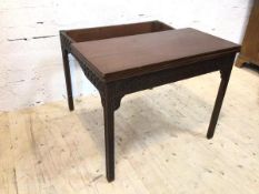 A 19thc mahogany card table the fold over top opens to baize interior on blind fret work frieze