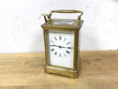 A late 19th early 20thc four glass carriage clock with roman chaptering, (18cm h including handle)