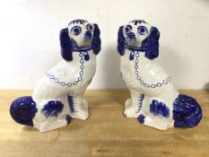 A pair of blue and white Staffordshire chimney spaniels (26cm h)