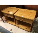 A pair of pine bedside tables with single drawer above recess on bun feet (51cm x 52cm x 42cm)