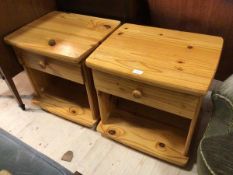 A pair of pine bedside tables with single drawer above recess on bun feet (51cm x 52cm x 42cm)