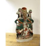 A 19thc Staffordshire flatback figure of two gentlemen with spaniel spill vase, (30cm h)