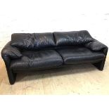 A two seater Maralunga black leather sofa with Cassina label, (73cm h x 192cm x 85cm)