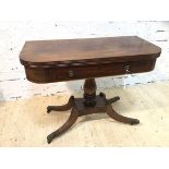 A Late Regency mahogany tea table, the fold over revolving top over frieze with faux drawer and