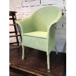 A Lloyd Loom by James Brindley armchair with label verso in mint green, (92cm x 70cm x 62cm)