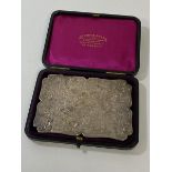A silver card case, Birmingham, with foliate engraving in Wilson & Sharp of Edinburgh box, (10cm x