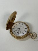 A ladies full hunter pocket watch, exterior with foliate decoration, dial inscribed Elgin, marked