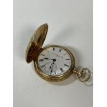 A ladies full hunter pocket watch, exterior with foliate decoration, dial inscribed Elgin, marked