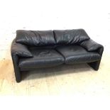 A two seater black leather Maralunga sofa with Cassina label (69cm x 170cm x 85cm)