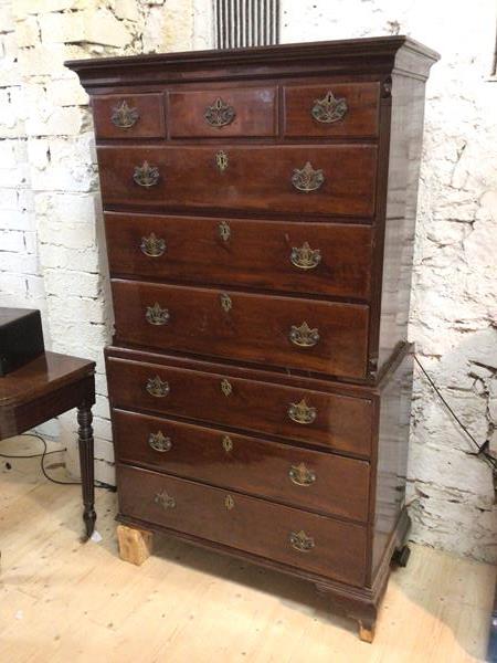 A George III mahogany chest on chest the moulded cornice over three short drawers and three