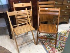 Two pairs of folding beech chairs one with slatted seat and pierced top rail, (when open 78cm x 46cm