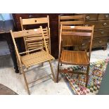 Two pairs of folding beech chairs one with slatted seat and pierced top rail, (when open 78cm x 46cm