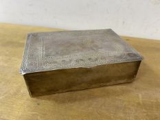 An Eastern white metal cigarette box with engraved decoration to top and Arabic inscription to base,