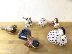 A group of six Royal Crown Derby animal figures including birds, rabbits, hamsters and piglet,