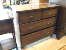 An early 20thc chest of drawers the rectangular top over two short drawers and three long drawers on
