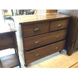 An early 20thc chest of drawers the rectangular top over two short drawers and three long drawers on