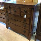 A 19thc Scottish mahogany chest of drawers the rectangular top over arrangement of short long and