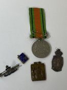 A WWII Defence Medal, a pendant with Royal lady in relief, inscribed Al Fante Sostegno, with a