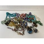 A collection of costume jewellery including lapis lazuli, turquoise, amethyst, silver ring with