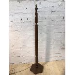A 1930's / 40's mahogany standard lamp with faceted stem on hexagonal base, (162cm to top of