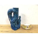 A vase in the form of a tree trunk with two birds having blue glaze, (25cm h) and a French teacup