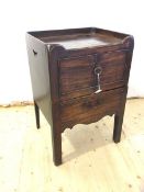 A 19thc commode the galleried top with pierced handles to sides above two doors opening to recess