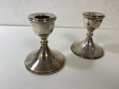 A pair of silver candlesticks, Birmingham, (8cm high)