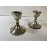 A pair of silver candlesticks, Birmingham, (8cm high)