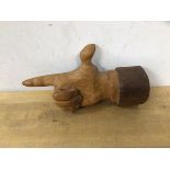 John Butler, hand carved anatomical wall hanging of finger pointing, label verso