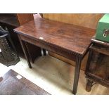 A 19thc mahogany tea table the fold over top with moulded edge above plain frieze on gateleg