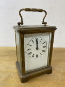 A brass and four glass carriage clock, roman numerals, (14cm h including handle)